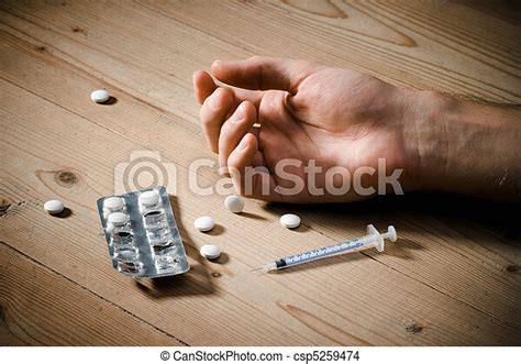 Drugs Overdose Drug Abuse Concept Passive Hand On Floor Pills And