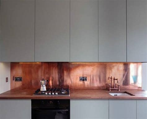 A neutral color palette such as the one in this kitchen backsplash can warm up a sleek, contemporary space. Top 50 Best Metal Backsplash Ideas - Kitchen Interior Designs