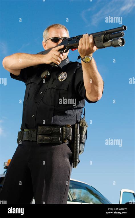 Police Officer Aiming Shotgun Stock Photo Alamy