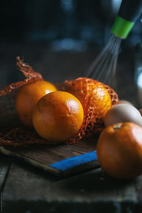 Whole Oranges On Kitchen Table By Stocksy Contributor Darren Muir