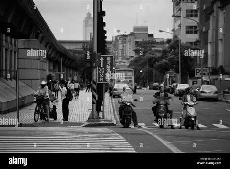 Taiwan Taipei Motorcycle Traffic Along Downtown City Street Stock Photo