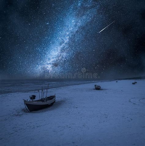 Milky Way And Falling Stars Over Boats By Baltic Sea Stock Image