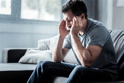 Depressed Young Man Suffering From Migraine Stock Photo Image Of Pain