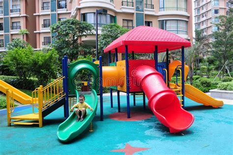 A Boy Play On The Colorful Slide Stock Image Image Of Child Naughty