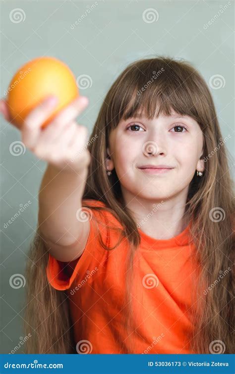 Girl Giving Orange Outstretched Arm Forward Stock Image Image Of