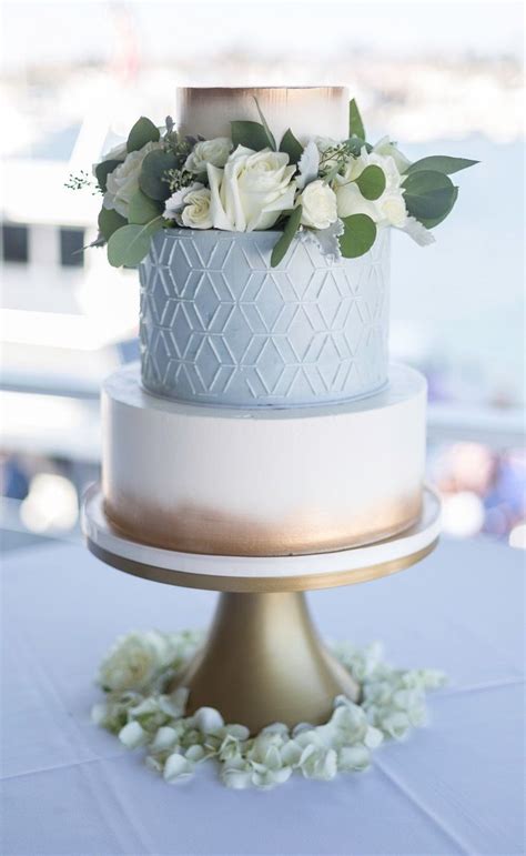 Repinned by #indianweddingsmag indianweddingsmag.com #weddingcake. Eligant baby blue and gold wedding cake | Floral wedding ...