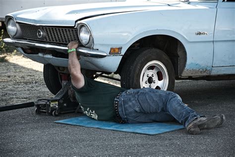 Man Working Under His Car · Free Stock Photo