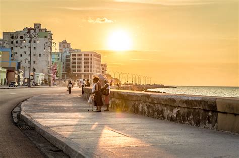 Sunset At Malecon Avenue In Havana Cuba The History Culture And