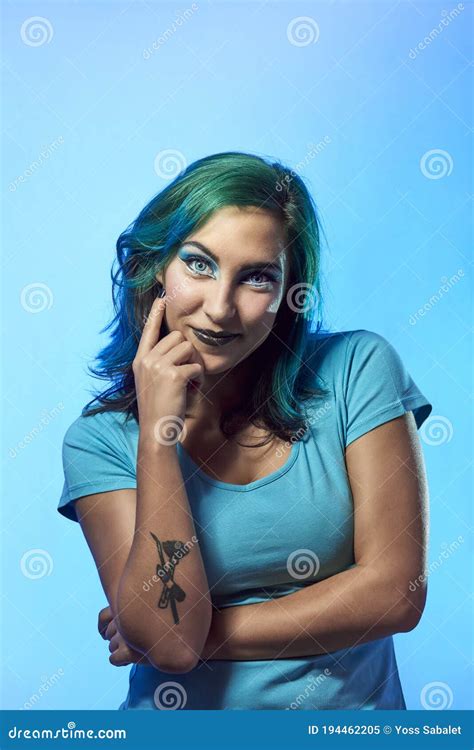 A Young Girl With Blue Hair On A Blue Background Stock Image Image