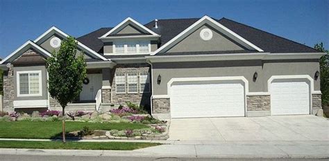As it relates to the exterior of your house certain paint schemes have stood up through the ages. Gray Stone Exterior | Gray Stucco with rock accent and ...