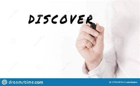 Hand Of A Businessman Writing A Word Discover With Black Marker Stock