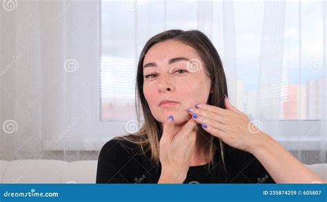 Woman Makes Herself A Neck Massage Along The Massage Lines And Points