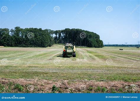 Kampen Overijssel The Netherlands Tractor Mowing Grass On A Green
