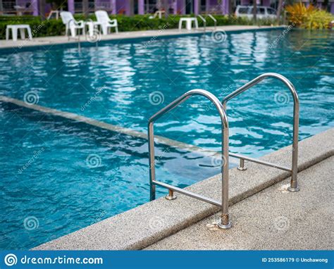 Stainless Steel Stairs To The Pool Handrails Up And Down The Pool
