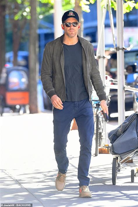 Ryan Reynolds Bundles Up In A Gray Suede Jacket While Taking A Solo