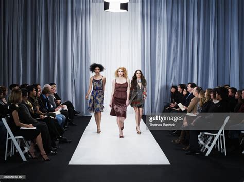 Three Female Models Walking Down Runway High-Res Stock Photo - Getty Images