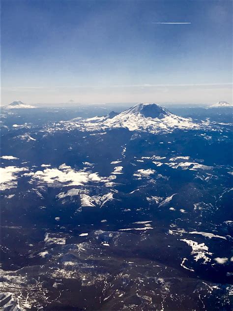 Aerial View Of The Cascade Mountain Range Featuring Mt Rainier Mt St