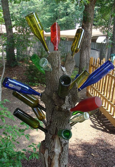 20 Ideas Of How To Enhance Your Garden With Glass Bottles Bottle Trees Wine Bottle Trees