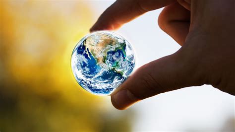 A Small Earth Globe The World In Our Hands
