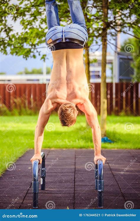 Workout In Summer Young Fit Caucasian Man Is Doing A Handstand Stock