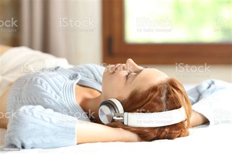Relaxed Woman Resting On Bed Listening To Music Stock Image Everypixel