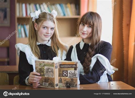 Russian Schoolgirls At The Desk At The Lesson ⬇ Stock Photo Image By
