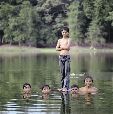 Young Boys Swimming In A River Near Angkor Wat High Res Stock Photo