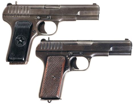 Two Tokarev Semi Automatic Pistols With Holsters A Soviet Tt 33 Pistol