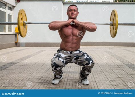 Bodybuilder Doing Front Squats With Barbells Stock Photo Image Of