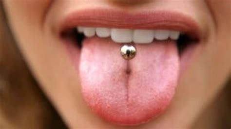 how to take care of tongue piercing behalfessay9