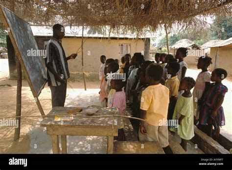 Children And Teacher In A Typical Open Air Village Primary School Near