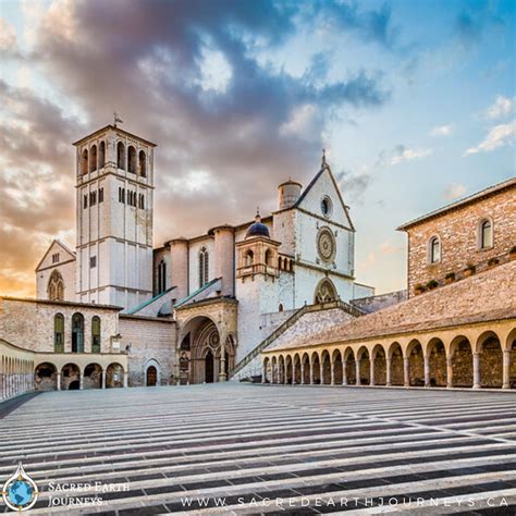 the famous basilica of st francis of assisi with its lower plaza at sunset in assisi umbria