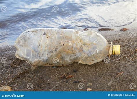 Water Pollution Problem Crumpled Plastic Bottle Floating In Ocean
