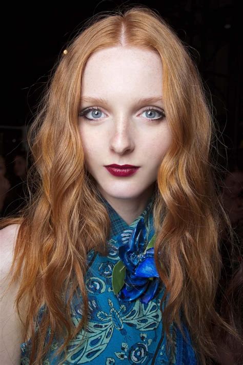 Fair Skinned Model With Long Wavy Ginger Copper Red Hair Wearing Blue