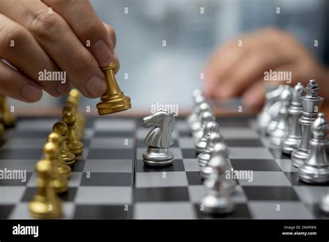 Businessman Play On Chess Board Game For Ideas And Competition And