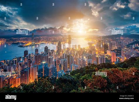 Hong Kong City Skyline At Sunrise View From Peak Mountain Stock Photo