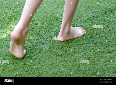 Bare Feet Walking On Grass In The Garden Stock Photo Alamy