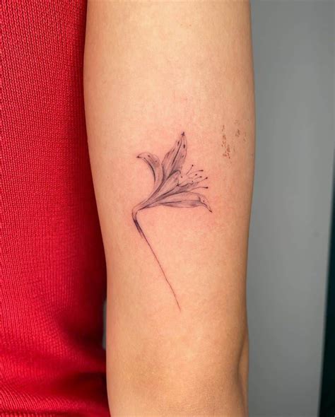 30 best lilytattoos and their meanings lily tattoo lily flower tattoos small lily tattoo