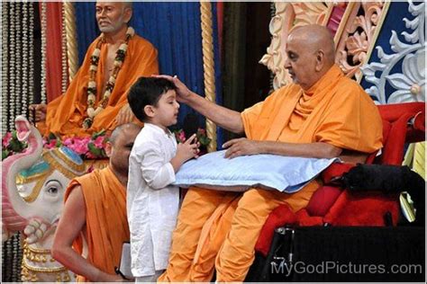 Pramukh Swami Maharaj Giving Blessing To Little Child God Pictures