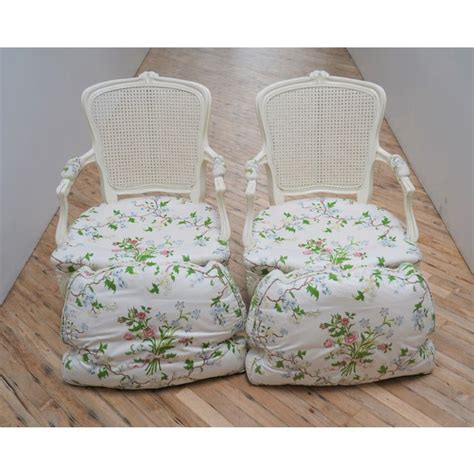 What kind of fabric is used for overstuffed chairs? Cane Backed Arm Chairs With Down Filled Floral Cushion - a ...