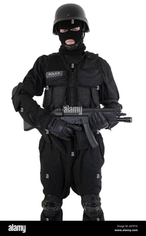 A Police Officer Dressed In A Swat Team Riot Uniform Holding And Stock