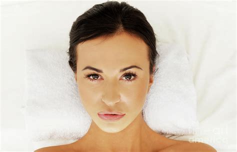 Beautiful Woman Lying On A Towel In Spa Photograph By Piotr Marcinski