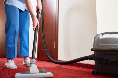 Hotel Maid Cleaning Carpet With Vacuum Cleaner Stock Image Everypixel