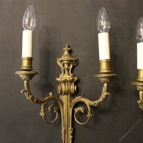 From adding a layer of flattering ambient light, compensating for where the overhead lighting doesn't reach or best practice: Antiques Atlas - French Pair Of Bronze Antique Wall Sconces