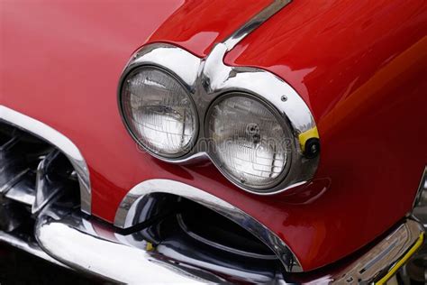 Classic American Retro Car Bumper And Headlight Of Red Vintage Car