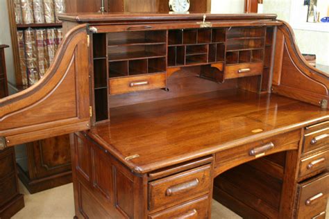 Its many spacious drawer options will accommodate all of your essentials with room for. Walnut Roll Top Desk with fold out side wings. www ...