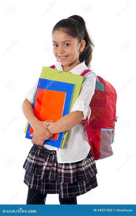 cute little hispanic school girl carrying schoolbag backpack and books