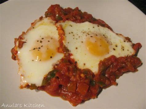 Shakshouka Eggs Poached In Tomatoes Food Poached Eggs Yum