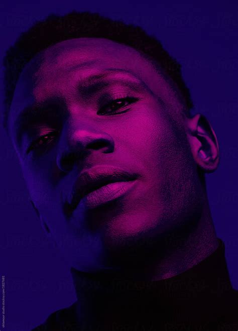 African American Man Portrait Under Blue And Purple Lights