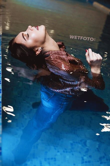 Underwater Shooting With A Beautiful Girl In Wet Skinny Jeans And Sexy Bodysuit Wetlookone